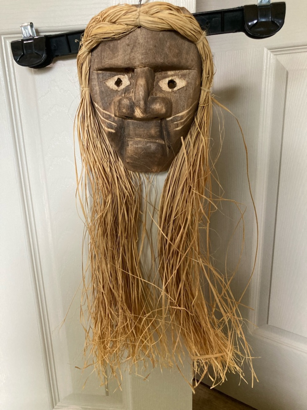 Hand-Carved Wooden Tribal Mask with Raffia Hair